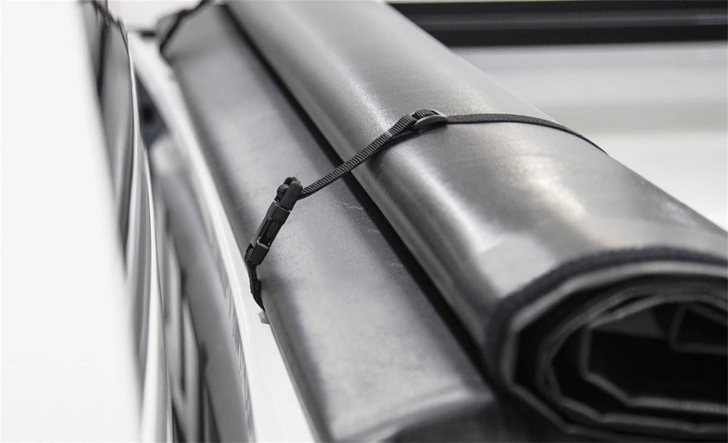 ACI Access Cover Lite Rider tonneau cover for 2007-2013 Chevy Silverado 1500 5.5-foot bed, shown on truck bed.