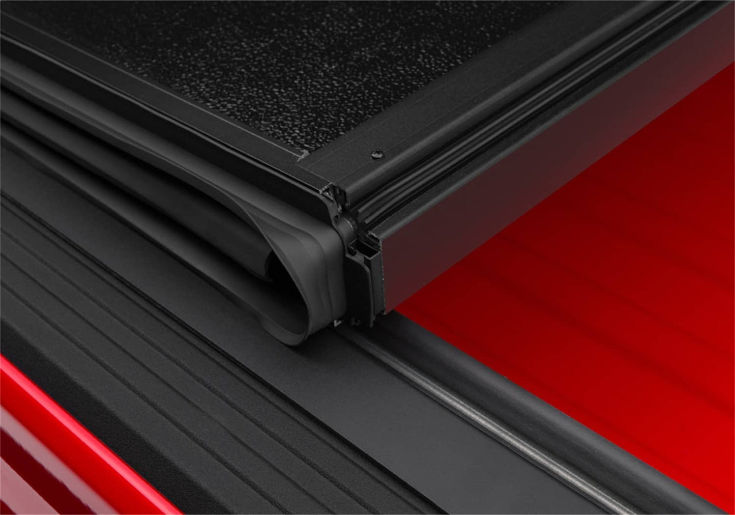 Undercover FLEX BOX CVR 20-26 Gladiator 5' tonneau cover installed on a truck bed, showcasing its sleek protective design.
