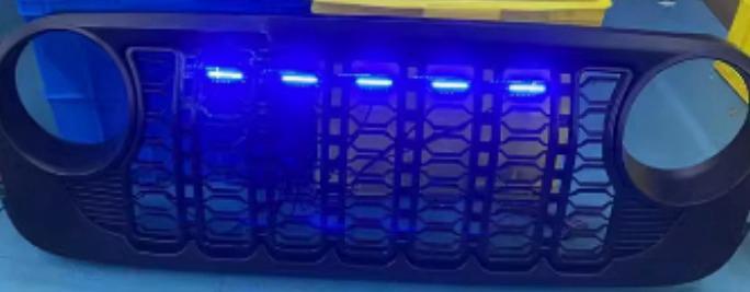 Colorful LED grille inserts for Jeep Wrangler JL/JLU/4XE/JT by OFFactory, featuring smart music sync and multi-color RGB lighting.