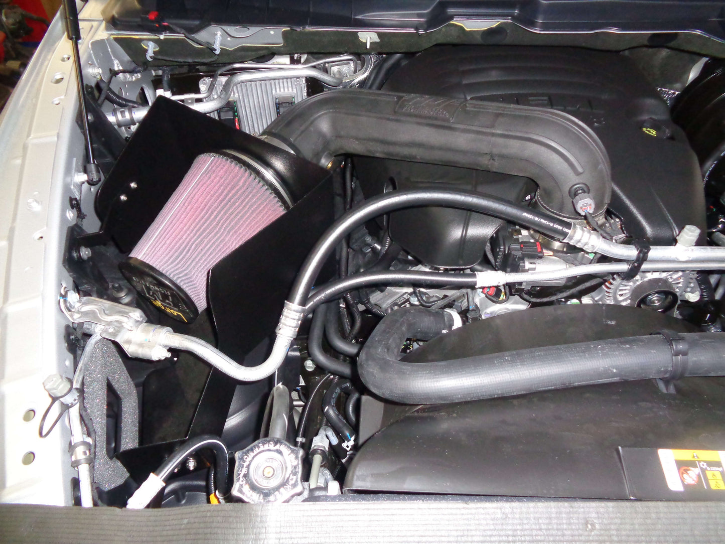Flowmaster Delta Force Performance Air Intake system installed in a vehicle engine bay, showcasing the cold air intake components.