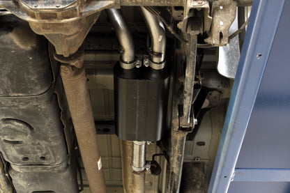 Flowmaster American Thunder cat-back exhaust system kit displayed, featuring polished stainless steel pipes and performance mufflers.