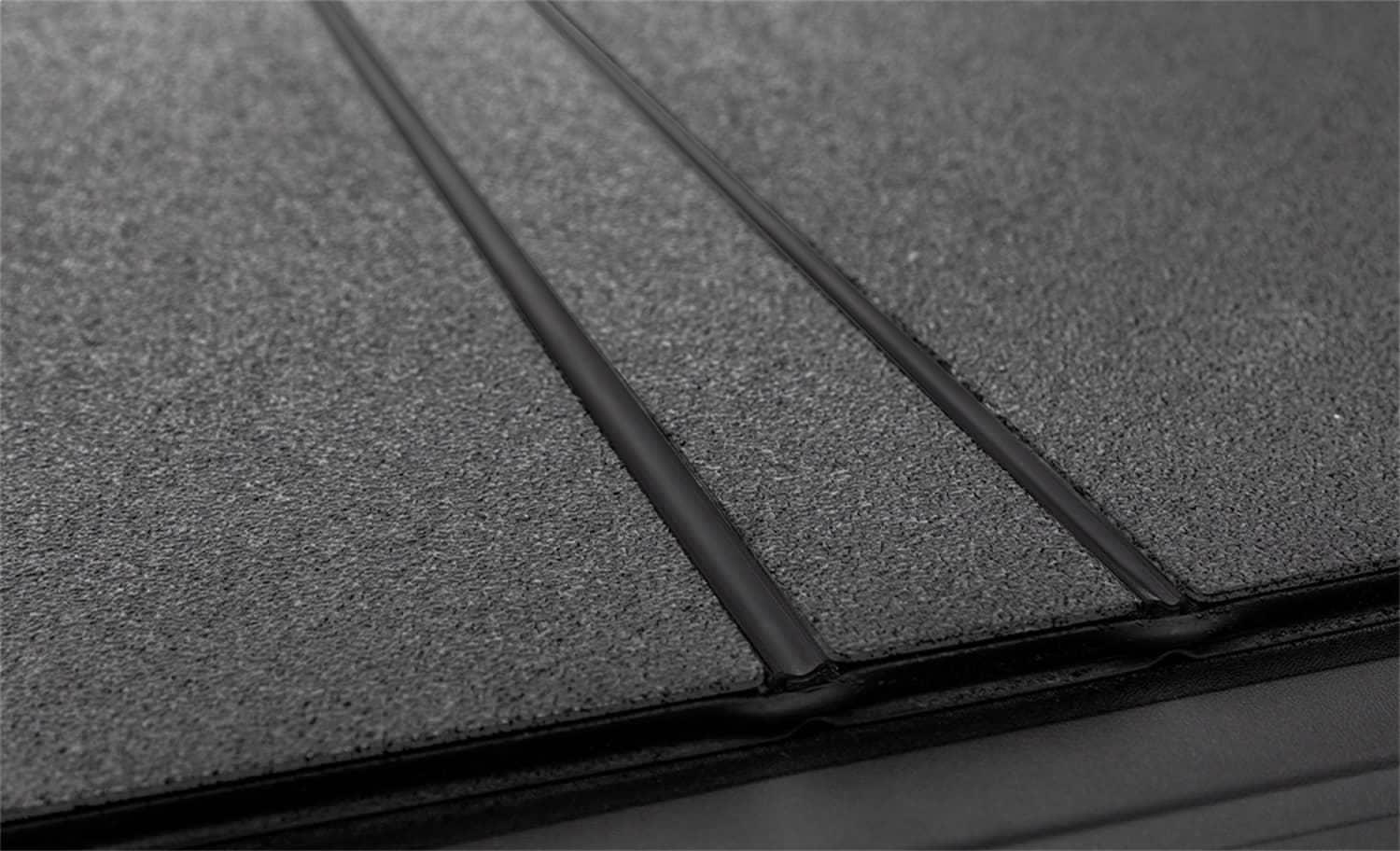 Black ACI LOMAX hard folding tonneau cover on a 2020-2026 Jeep Gladiator 5ft bed, low profile design, without trail rail.