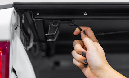 Black LOMAX hard folding tonneau cover for 2020-2026 Jeep Gladiator 5ft bed, low profile design by ACI.
