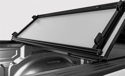 Black ACI LOMAX STANCE hard folding tonneau cover on a 2020-2026 Jeep Gladiator with Trail Rail System, showing the closed cover on the truck bed.
