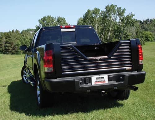 Custom Flow Tailgates Elite tailgate for Ford F150 2009-2014, shown in black with sleek design and sturdy construction.