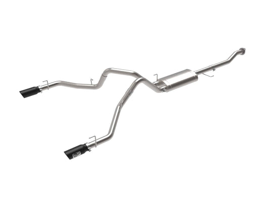 aFe Power S/S exhaust system installed on a 2015-2020 Ford F-150 pickup truck, showcasing polished metal piping and exhaust tips