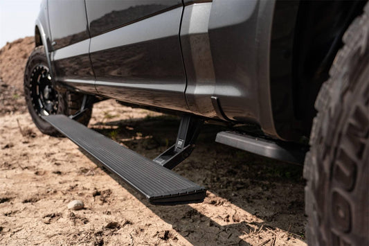 AMP Research Power Steps Xtreme for 2021-2026 Ford F150, close-up view showing durable step surface and vehicle mounting points.