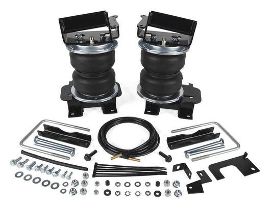 Air Lift spring kit for 2021-2026 Ford F150 PowerBoost with air bags, shown installed on vehicle for improved load support.