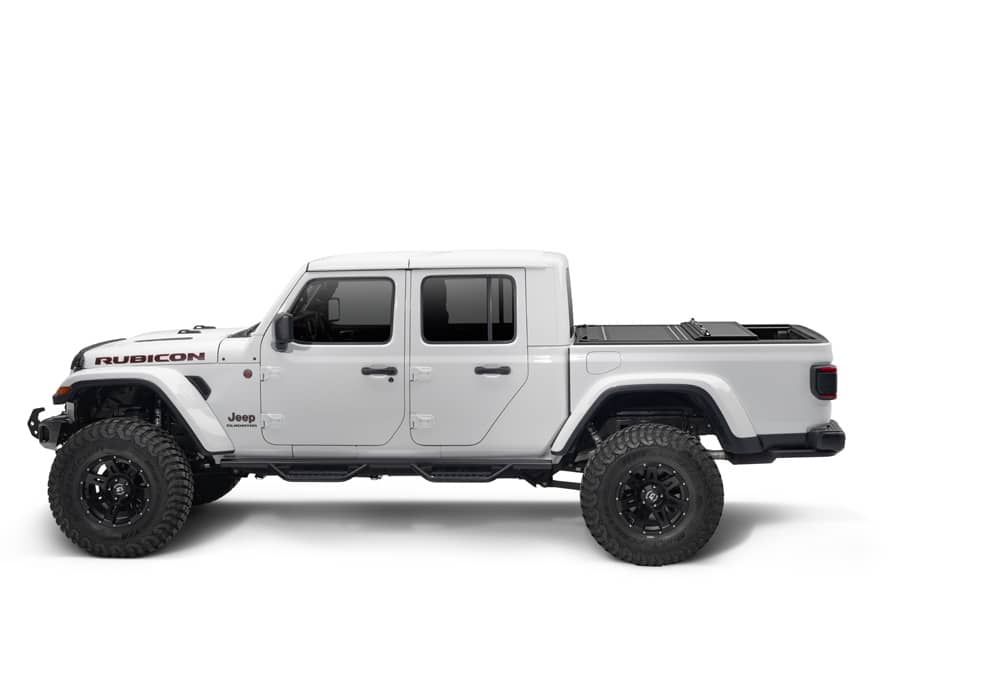 BAK MX4 hard folding tonneau cover in matte aluminum on Jeep Gladiator 5ft bed, featuring tailgate lock system and 400lb capacity