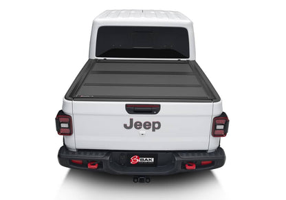 BAK MX4 matte aluminum hard folding tonneau cover on Jeep Gladiator 5ft bed, with tailgate lock system and 400lb capacity
