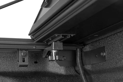 BAK MX4 TS hard folding tonneau cover on Jeep Gladiator 5ft bed, showing heavy-duty aluminum construction and T-slot rails.