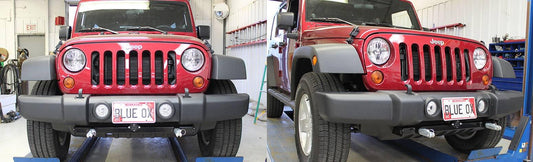 Blue Ox BASEPLATE 07-18 Jeep Wrangler JK tow bar installation with reinforced steel construction and mounting points.