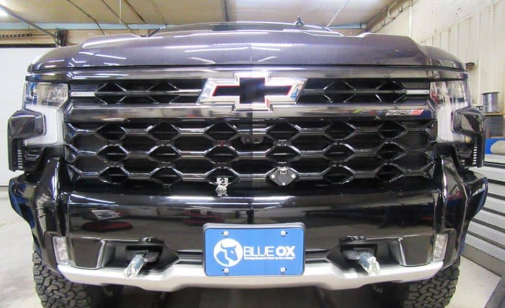 Blue Ox baseplate for 2022-2026 Chevy Silverado 1500 ZR2 tow bar installation, shown on vehicle front.