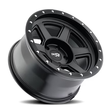 Dirty Life Compound 9315 matte black 17x9 inch off-road wheel with 5-127 bolt pattern and -12mm offset, by 4x4 Wavers.