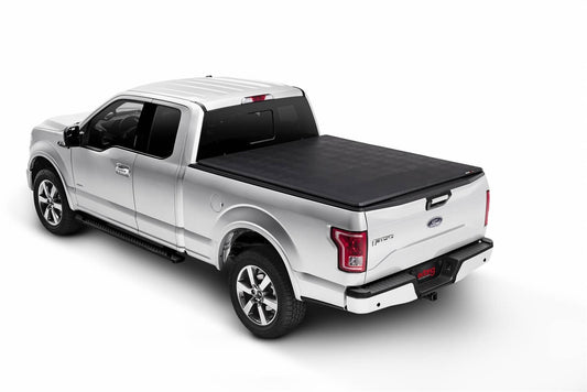 Extang Tonneau Cover for 2015-2020 Ford F150 6.5' bed, black soft cover installed on truck bed in outdoor setting.
