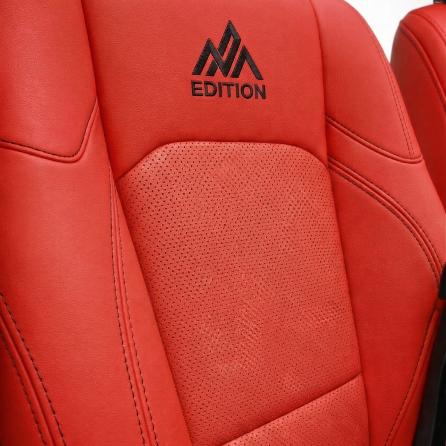 OFFactory custom leather seat covers, sleek fitted black leather seats.