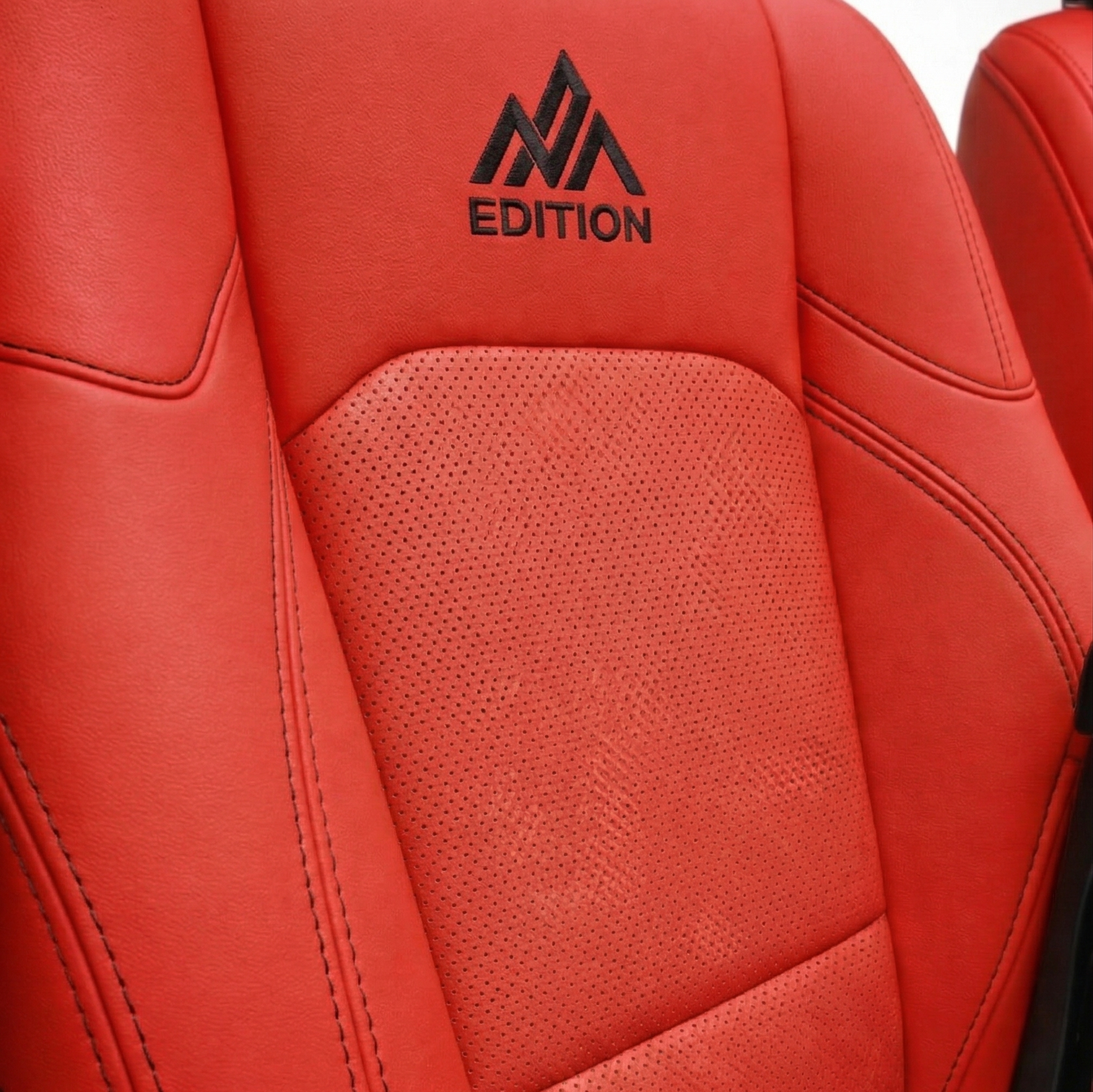 OFFactory custom leather seat covers, sleek fitted black leather seats.