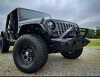 4X4 WAVERS Body Armor Orion front bumper for 2007-2026 Jeep Wrangler JK, JL, and Gladiator JT showing rugged steel construction.