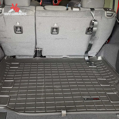 Close-up of the raised perimeter wall engineered to contain water mud snow and debris inside the cargo liner