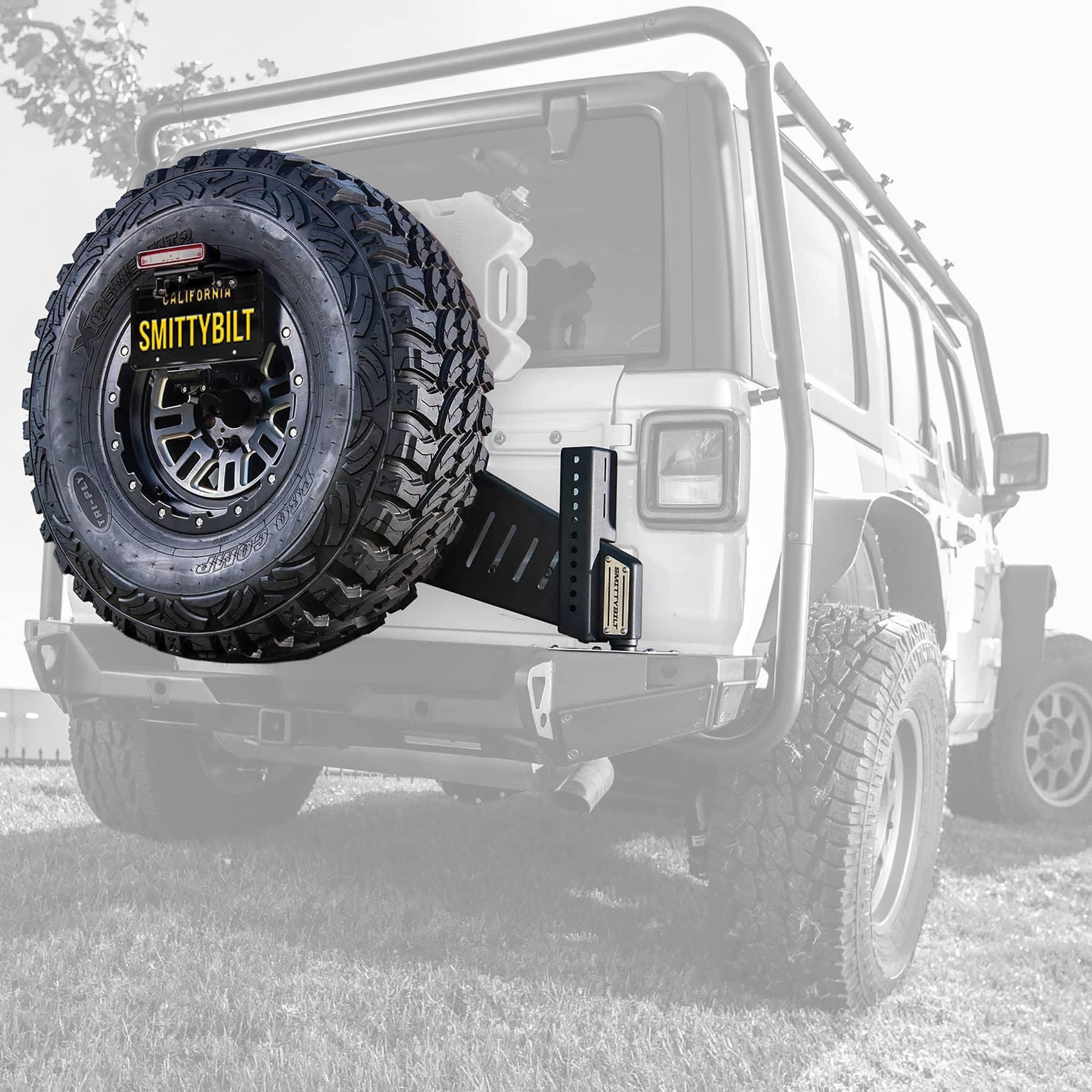 Smittybilt XRC GEN3 tire carrier for 18-25 Jeep Wrangler JL bumpers, durable metal construction with tire mounting hardware.