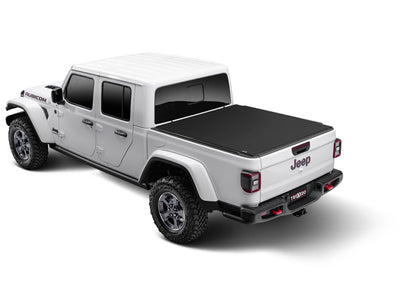 Truxedo SENTRY CT tonneau cover for 20-26 Gladiator trucks, protective black cover with sleek design, installed on the truck bed.
