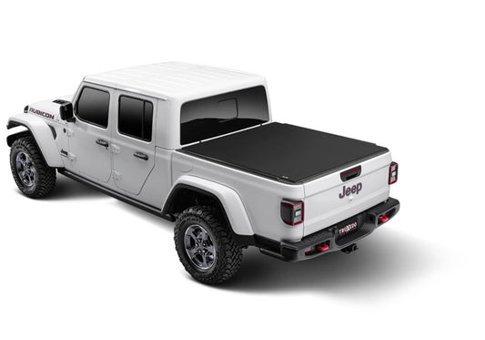 Truxedo SENTRY CT tonneau cover for 20-26 Gladiator trucks, protective black cover with sleek design, installed on the truck bed.