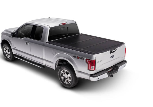 Undercover FLEX BOX CVR 04-14 F150 5.5' tonneau cover shown on a pickup truck bed for secure cargo protection.