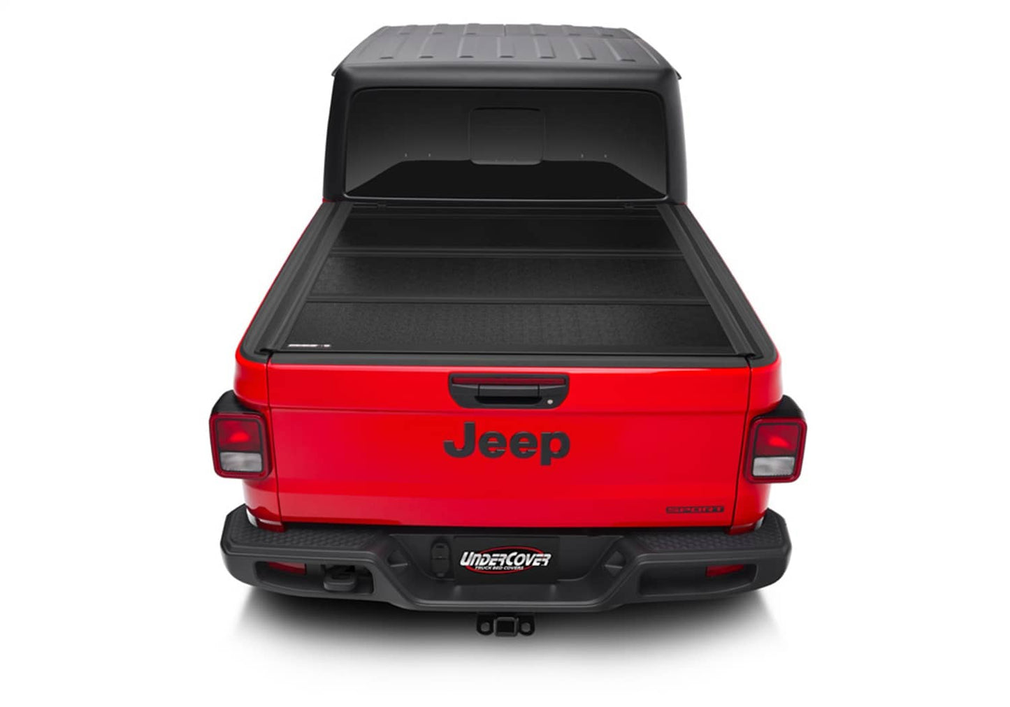 Undercover FLEX BOX CVR 20-26 Gladiator 5' tonneau cover installed on a truck bed, showcasing its durable design and secure fit.