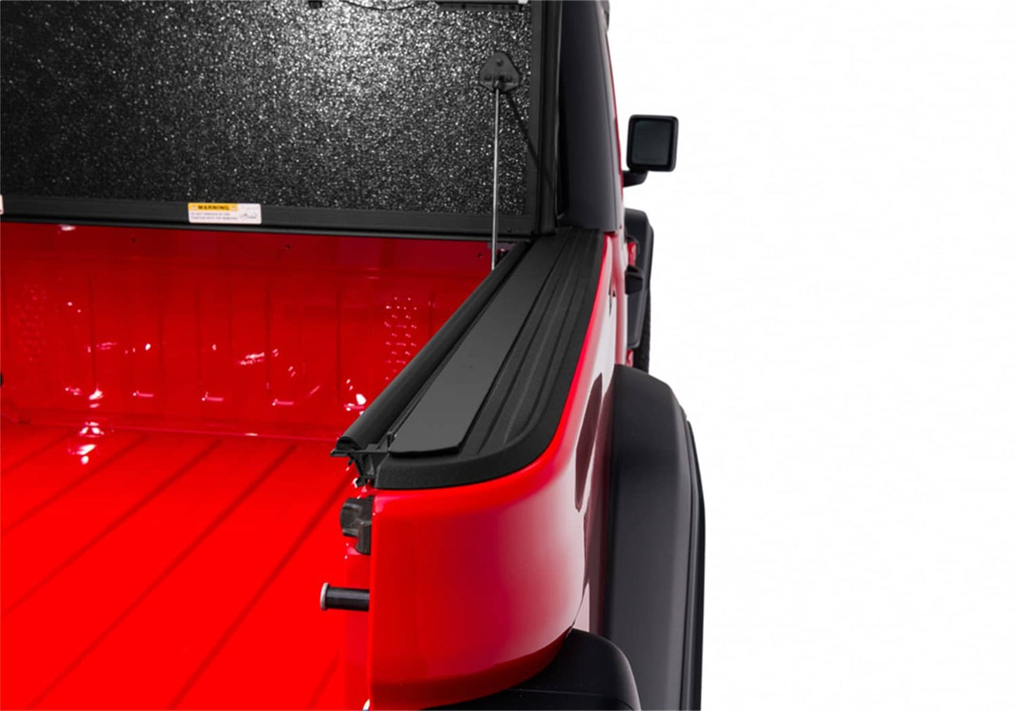 Undercover FLEX BOX CVR 20-26 Gladiator 5' tonneau cover installed on a truck bed, showing durable black material and secure fit.