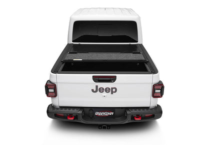 Undercover Ultra Flex Box CVR 20-26 Gladiator 5' tonneau cover installed on truck bed, showcasing its sleek design and secure fit.