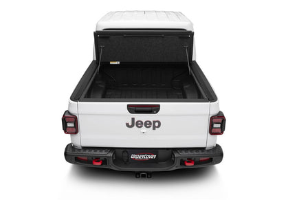 Undercover Ultra Flex Box CVR 20-26 Gladiator 5' tonneau cover installed on a truck bed, showcasing its sleek design.