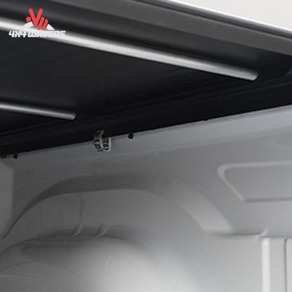 Close-up of the interior ceiling and upper side panel of a white vehicle cargo space or van, showing a black trim strip, mounting hardware.