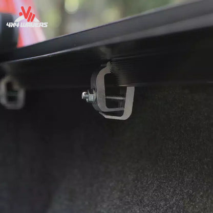 Close-up view of the dual automatic latch mechanism that locks the roll up cover firmly to the side rails SKU BGPC_41369.