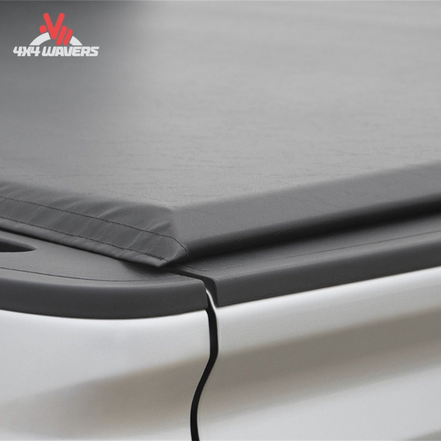 An ultra low profile 1 inch black vinyl soft roll up truck bed cover installed on a short box Ford F-150 Lightning SKU BGPC_41369.