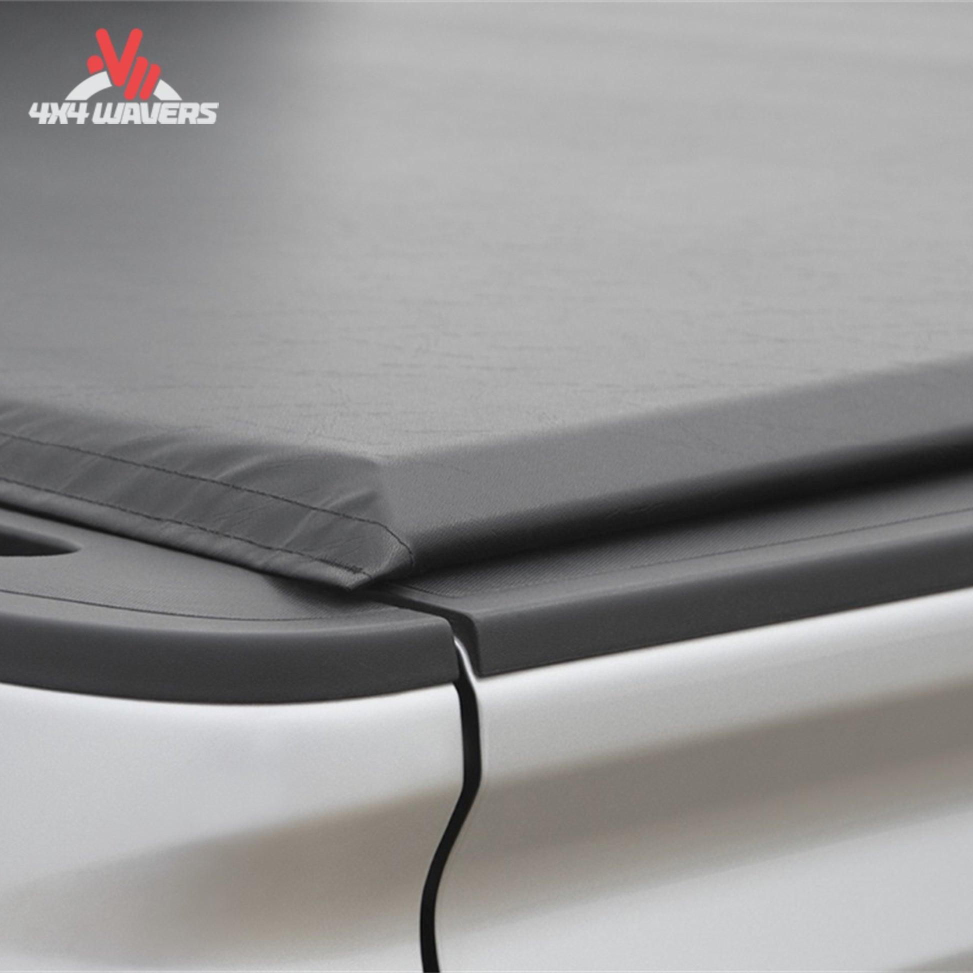 An ultra low profile 1 inch black vinyl soft roll up truck bed cover installed on a short box Ford F-150 Lightning SKU BGPC_41369.