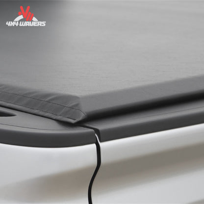 An ultra low profile 1 inch black vinyl soft roll up truck bed cover installed on a short box Ford F-150 Lightning SKU BGPC_41369.