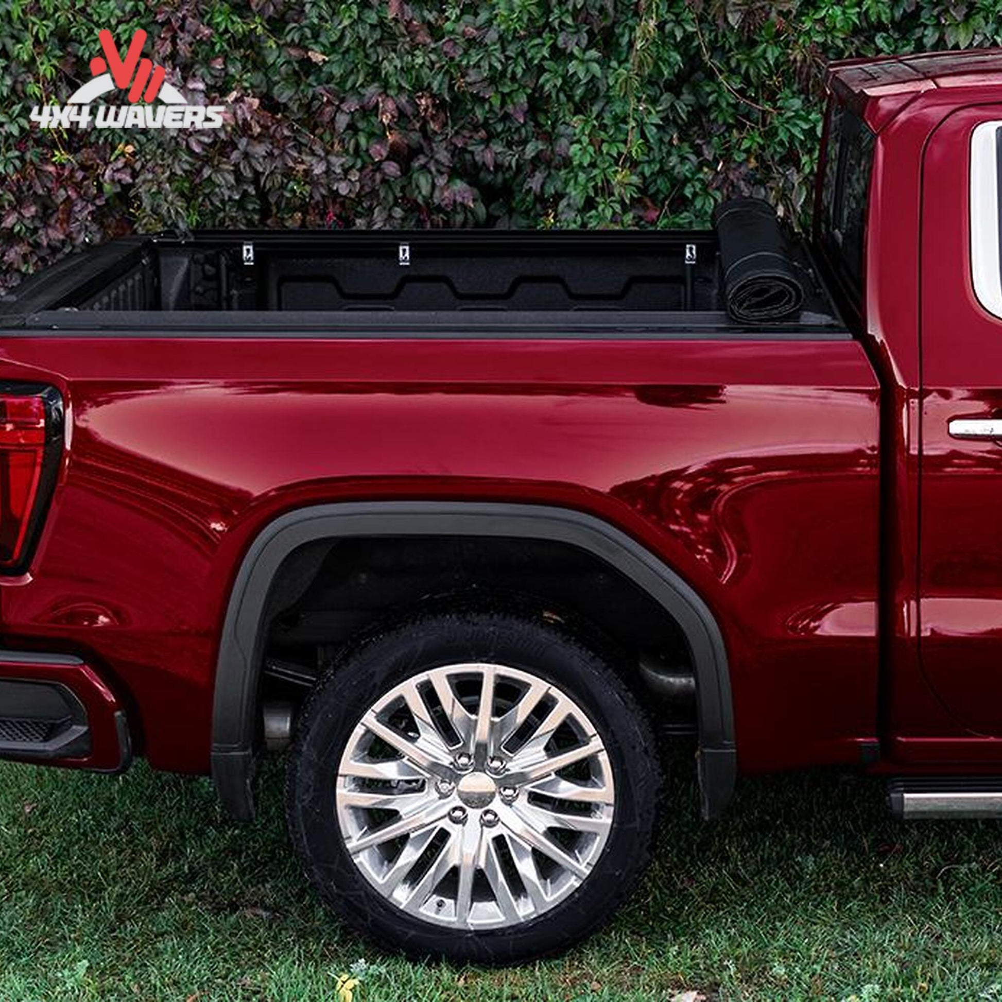 A 5.5 foot soft vinyl tonneau cover completely rolled up behind the truck cab showing full open bed access SKU BGPC_41369.