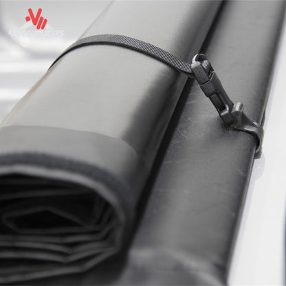 A 5.5 foot soft vinyl tonneau cover completely rolled up behind the truck cab showing full open bed access SKU BGPC_41369.