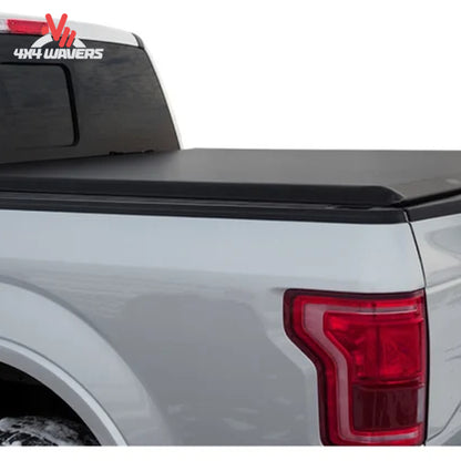 Sleek black roll-up truck bed cover closed on 5.5 foot Ford F150 Raptor bed SKU 11269