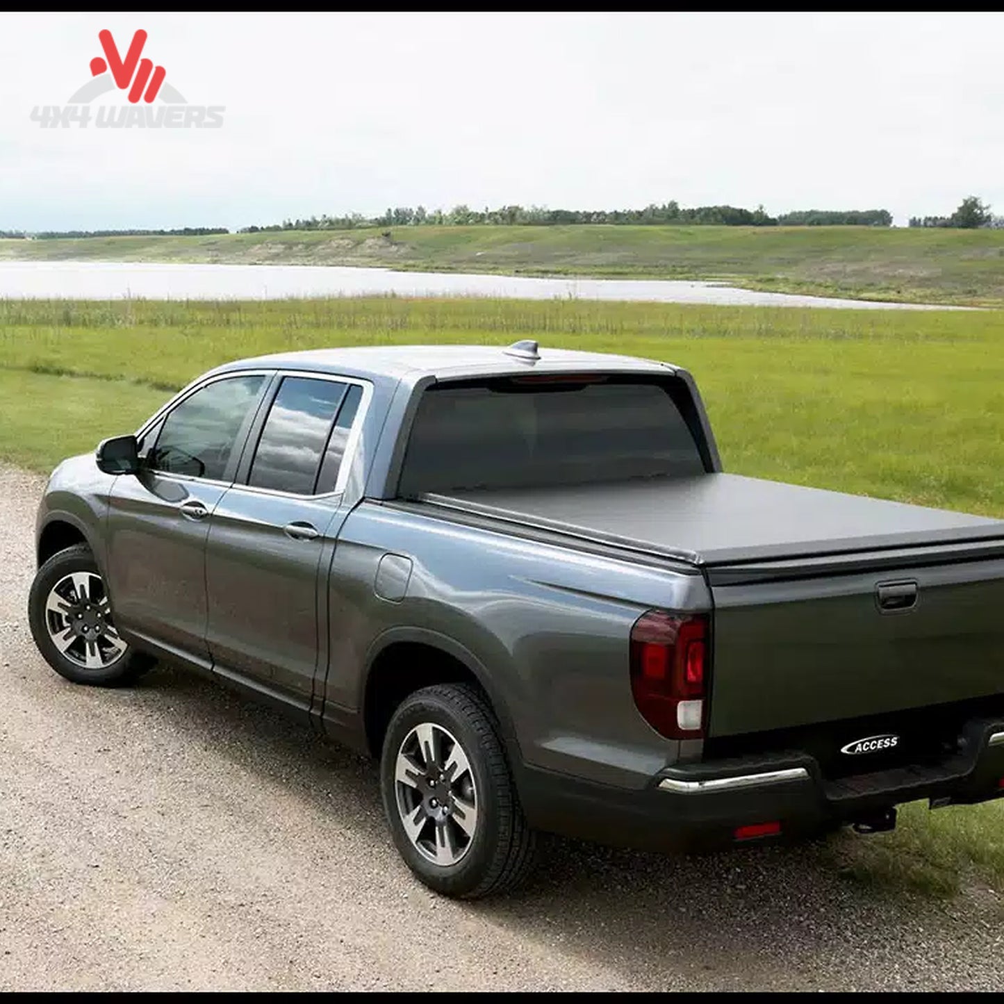 A premium black vinyl soft roll up truck bed cover installed on a short box Ford F-150 Lightning.