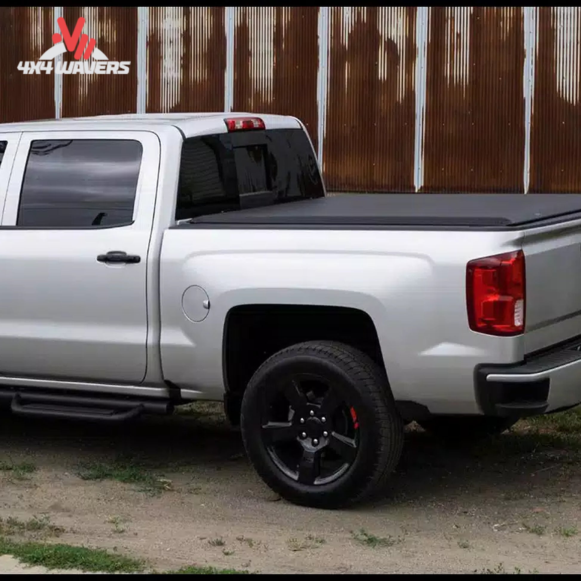 A premium black vinyl soft roll up truck bed cover installed on a short box Ford F-150 Lightning.