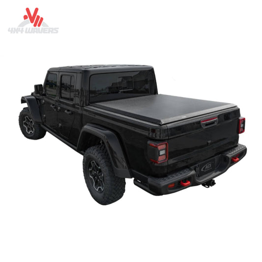 Access Original Soft Roll-Up Tonneau Cover on a 2020-2026 Jeep Gladiator JT with Trail Rail system, showing the rolled-up cover on the truck bed.