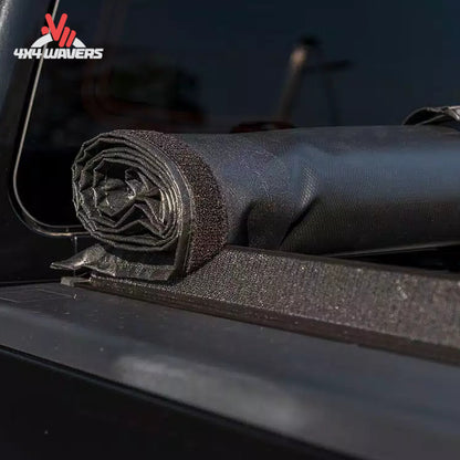 ACCESS roll up bed cover rolled completely forward to the cab with safety storage straps secured.