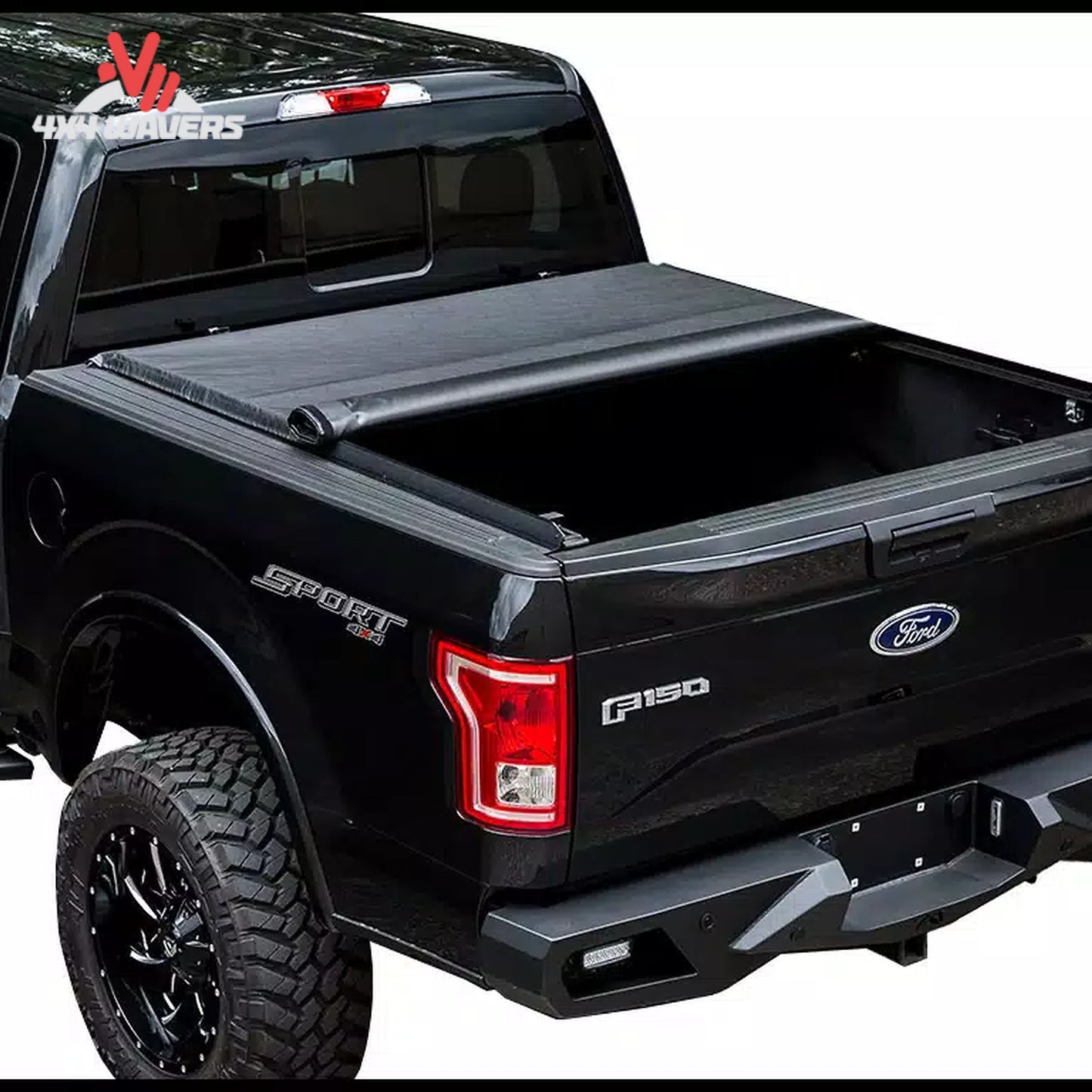 The soft vinyl tonneau cover completely rolled up behind the truck cab window for full cargo space access.