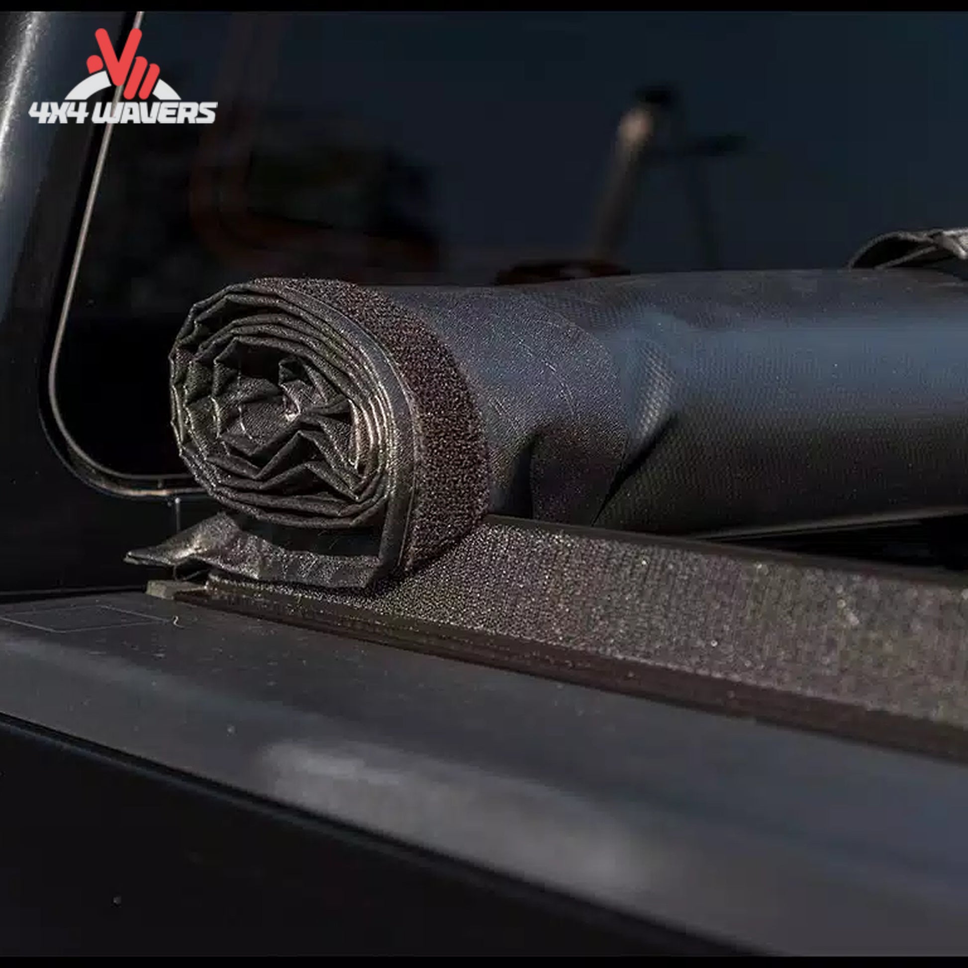 An 8 foot soft vinyl tonneau cover completely rolled up behind the truck cab showing open bed access SKU BGPC_11389.