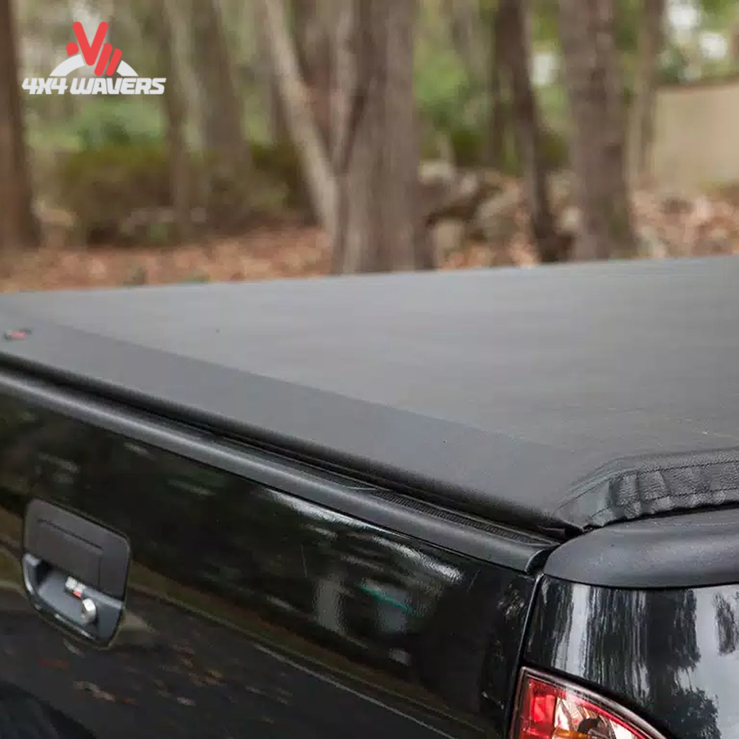 Close-up detail of the automated structural side latch system that secures the roll up tonneau cover near the tailgate.