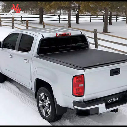 Close-up detail of the automated structural side latch system that secures the roll up tonneau cover near the tailgate.