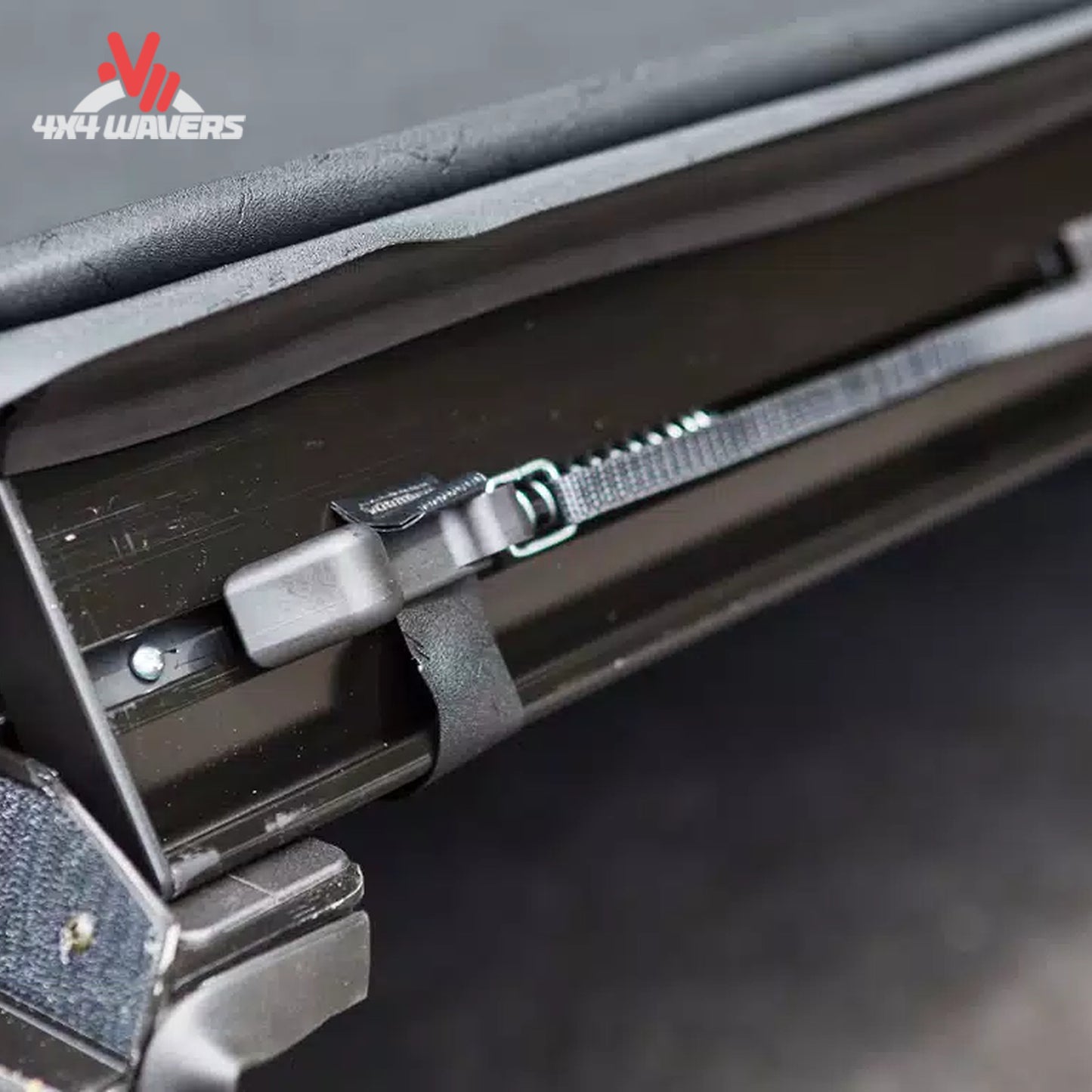 A close-up showing the manual dial tension adjustment mechanism to keep the soft vinyl cover tight in winter.