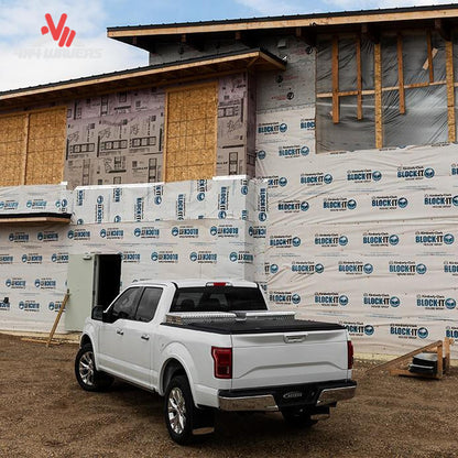 A soft roll up vinyl tonneau cover mounted behind a crossover toolbox on a 6.5 foot standard box Ford F-150 SKU BGPC_61379.