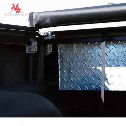 Close-up detail showing the aluminum header bar and foam gasket sealing the tonneau cover against the back of a metal crossover toolbox SKU BGPC_61379.